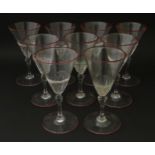 Salviati & Co. Glassware: Nine Venetian glass pedestal drinking glasses with pink detail to rims.