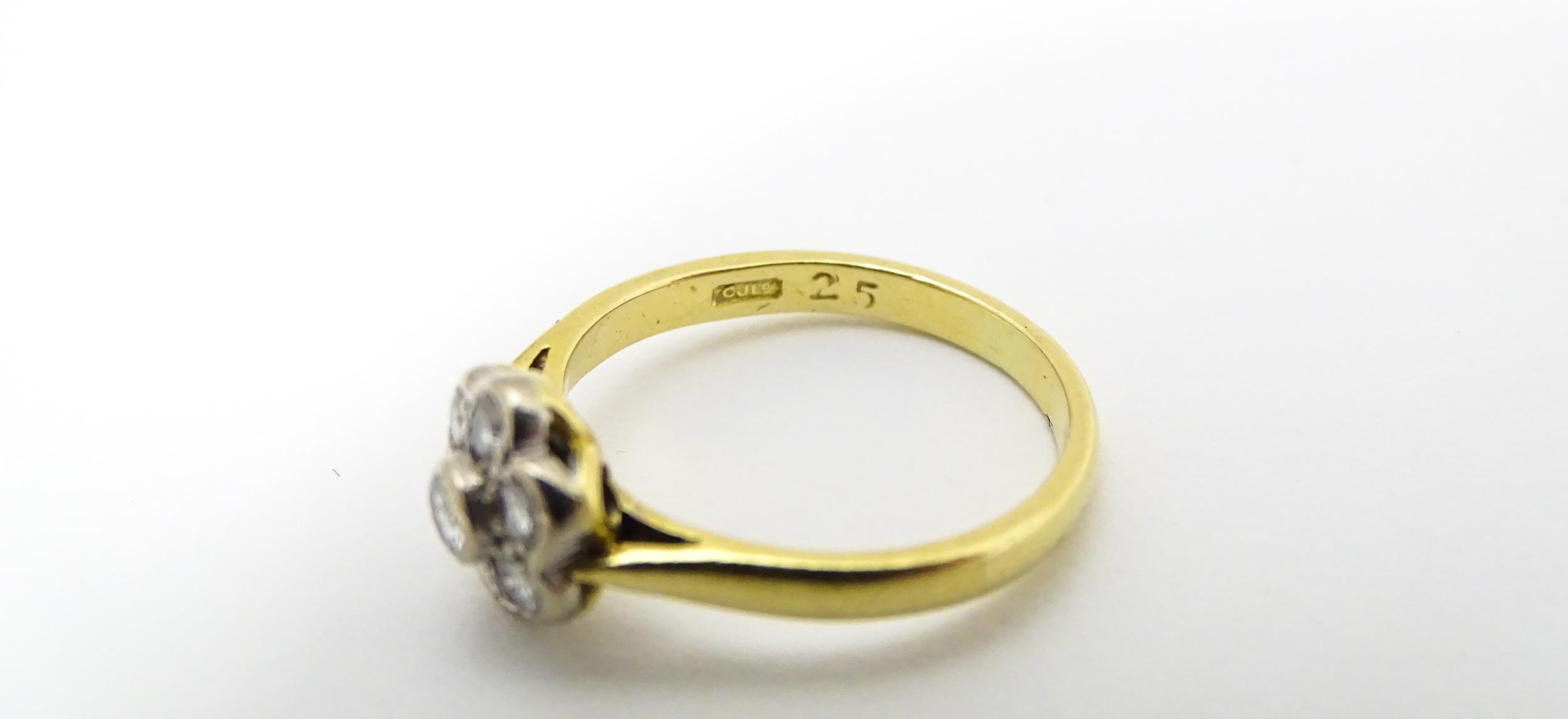 An 18ct gold ring set with 7 diamonds in a daisy setting. Ring size approx. H Please Note - we do - Image 10 of 10