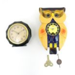 A Japanese novelty clock formed as an owl, by Mi-Ken and marked Japan. Together with a mid-century