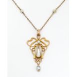 An Art Nouveau 9ct gold necklace set with pearl detail, marked 9ct and with mark for B H Joseph & Co