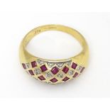 A 9ct gold ring set with rubies and diamonds. Ring size approx L 1/2 Please Note - we do not make
