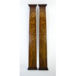 Two 19thC walnut pilasters with shaped cornices and plinths, the central panels decorated with