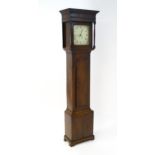 An early 19thC 30-hour oak cased long case clock. The painted dial signed Wm Nelson, Steeple