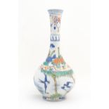 A Chinese bottle vase decorated with birds, flowers and foliage, Character script to top rim.