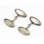 A pair of silver cufflinks hallmarked Chester 1895 maker Charles Horner. Please Note - we do not