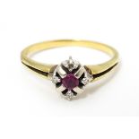A 14ct gold ring set with central ruby bordered by four diamonds. Ring size approx. Q Please