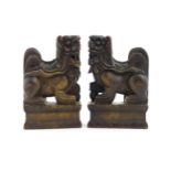 A pair of Oriental carved wooden foo dogs. Approx. 7" high (2) Please Note - we do not make