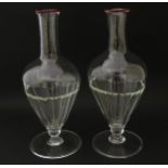 Salviati & Co. Glassware: Two Venetian glass carafes with pink detail to rims. Approx. 11" high (