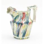 A 19thC small jug with zoomorphic spout decorated in Pratt colours. Approx. 4 1/4" high Please