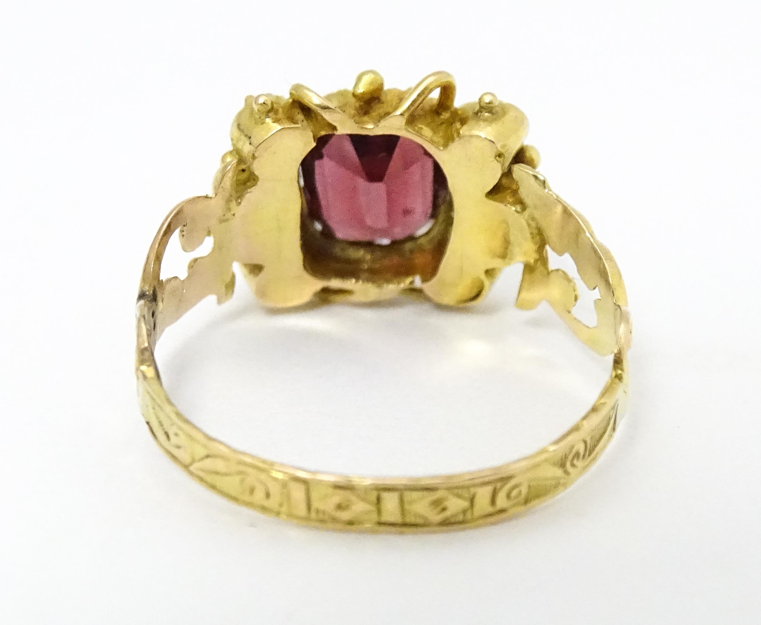 A Victorian 12ct gold ring set with garnet and pearl hallmarked Birmingham 1857. Maker J.A Ring size - Image 5 of 6