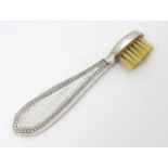 A silver handled moustache brush with engine turned decoration. Hallmarked Birmingham 1927 Please