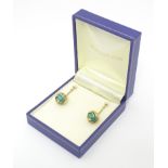 A pair of 9ct gold drop earrings set with turquoise. Approx 1 1/2" long Please Note - we do not make