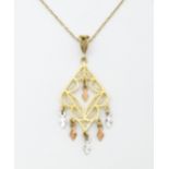 A 9ct gold pendant with filigree detail on a 9ct gold chain. The pendant approx 2" long. The chain