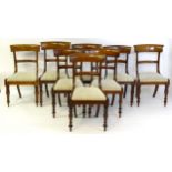 A group of eight 19thC mahogany dining chairs, with bowed top and mid rails above drop in seats