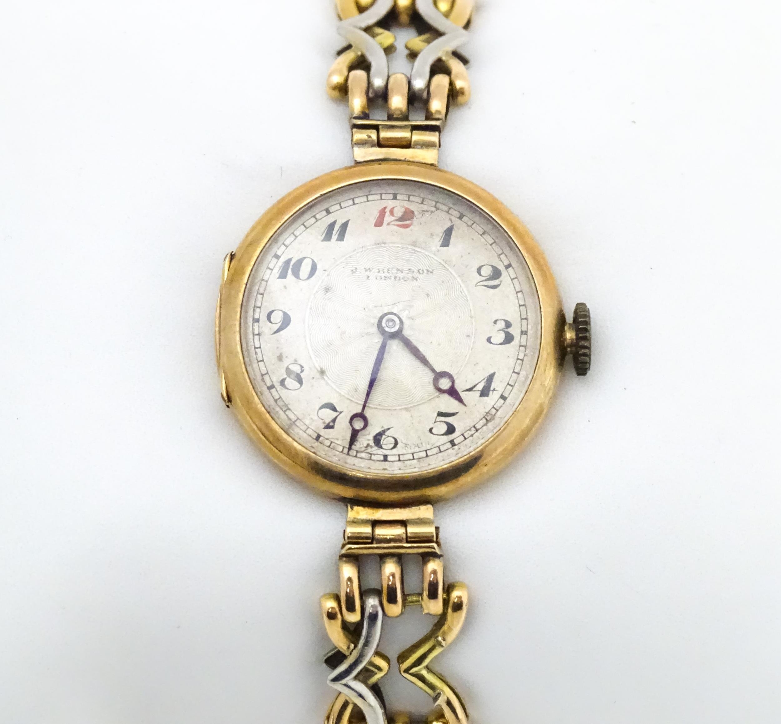 A c.1925 9ct gold cast ladies wristwatch, the dial with engraved decoration, Arabic numerals and - Image 4 of 11