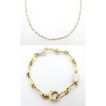 A gold chain with pearl detail. Approx. 50" long, Together with additional section approx. 4 1/2"