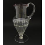 Salviati & Co. Glassware: A Venetian glass jug of pedestal form with pink detail to rim. Bears label