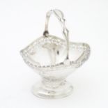 A silver sugar basket with swing handle, hallmarked Birmingham 1927 maker Henry Matthews Approx. 3