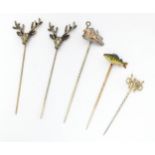 Five assorted yellow and white metal stick pins to include two decorated with stag head detail,