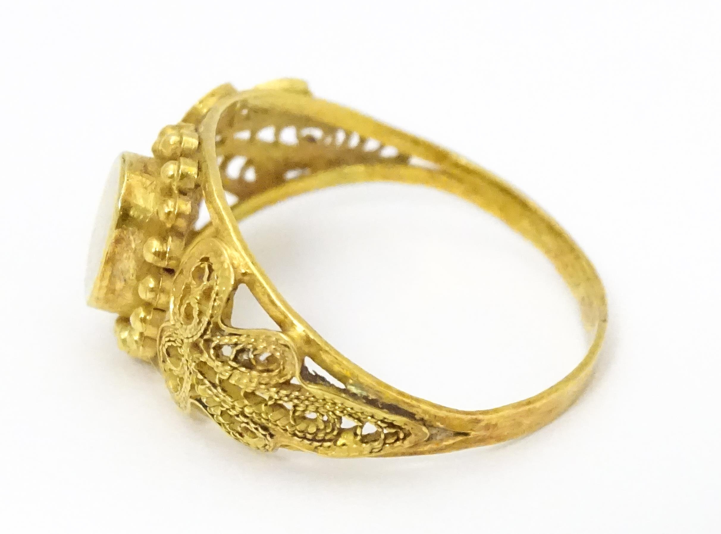 A yellow metal ring with filigree decoration. Ring size approx. K 1/2 Please Note - we do not make - Image 6 of 7