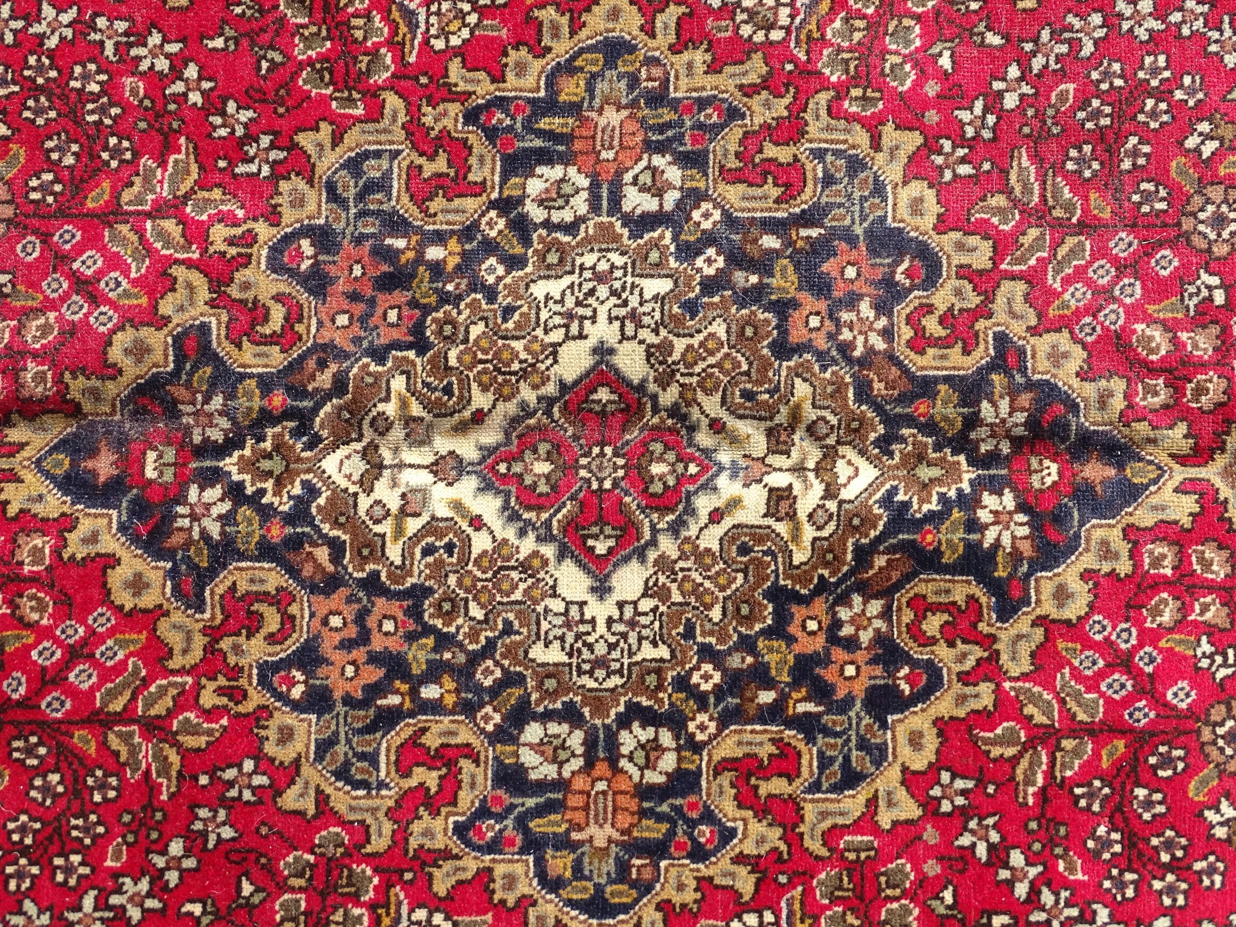 Carpet / Rug : A North West Persian Tabriz carpet, the red ground with central medallion of floral - Image 3 of 6
