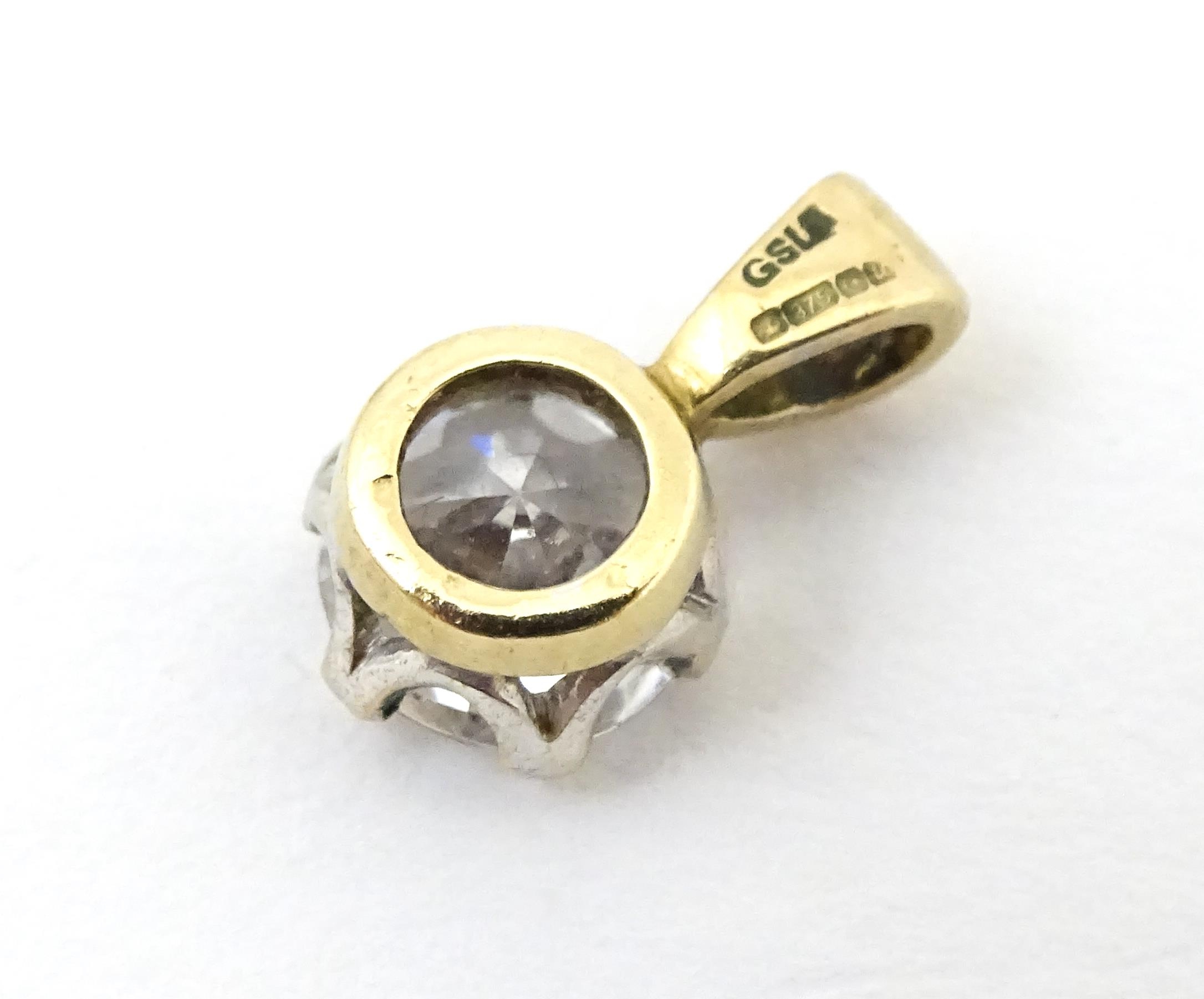 Three 9ct gold pendants set with cubic zirconia. To include a white gold example. Approx 1/2" - Image 5 of 7