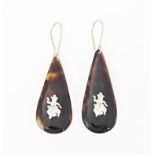 A pair of tortoiseshell drop earrings. Approx 1 1/2" long Please Note - we do not make reference