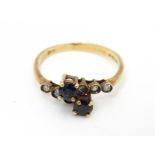 A 9ct gold ring set with sapphires and diamonds. Ring size approx. L Please Note - we do not make