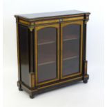 A 19thC pier cabinet with burr walnut veneers, an ebonised finish and inlaid satinwood stringing.