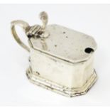 A silver mustard pot with hinged lid and glass liner. Hallmarked Birmingham 1913 maker S W Smith &