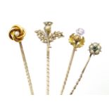 Gour assorted gold and gilt metal stick pins, including a 15ct gold example and including examples