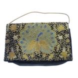 Vintage fashion / clothing: A black velvet clutch / handbag, hand embellished with a peacock design,