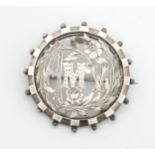 A silver brooch of circular form titled ' Amy' to centre. Approx 1 1/2" diameter Please Note - we do