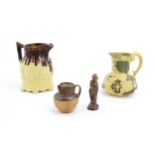 Four assorted Victorian and later stoneware items to include a Royal Doulton jug, a small Doulton