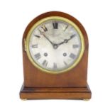 A mahogany cased mantle clock, the silvered dial with roman numerals and signed Robert Sawers