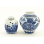 A Chinese blue and white ginger jar and cover decorated with figures in a landscape. Together with