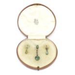 A 19thC suite of jewellery comprising pendant and drop earrings each set with green stones and