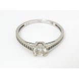 A 9ct white gold ring set with cubic zirconia. Ring size approx. S Please Note - we do not make