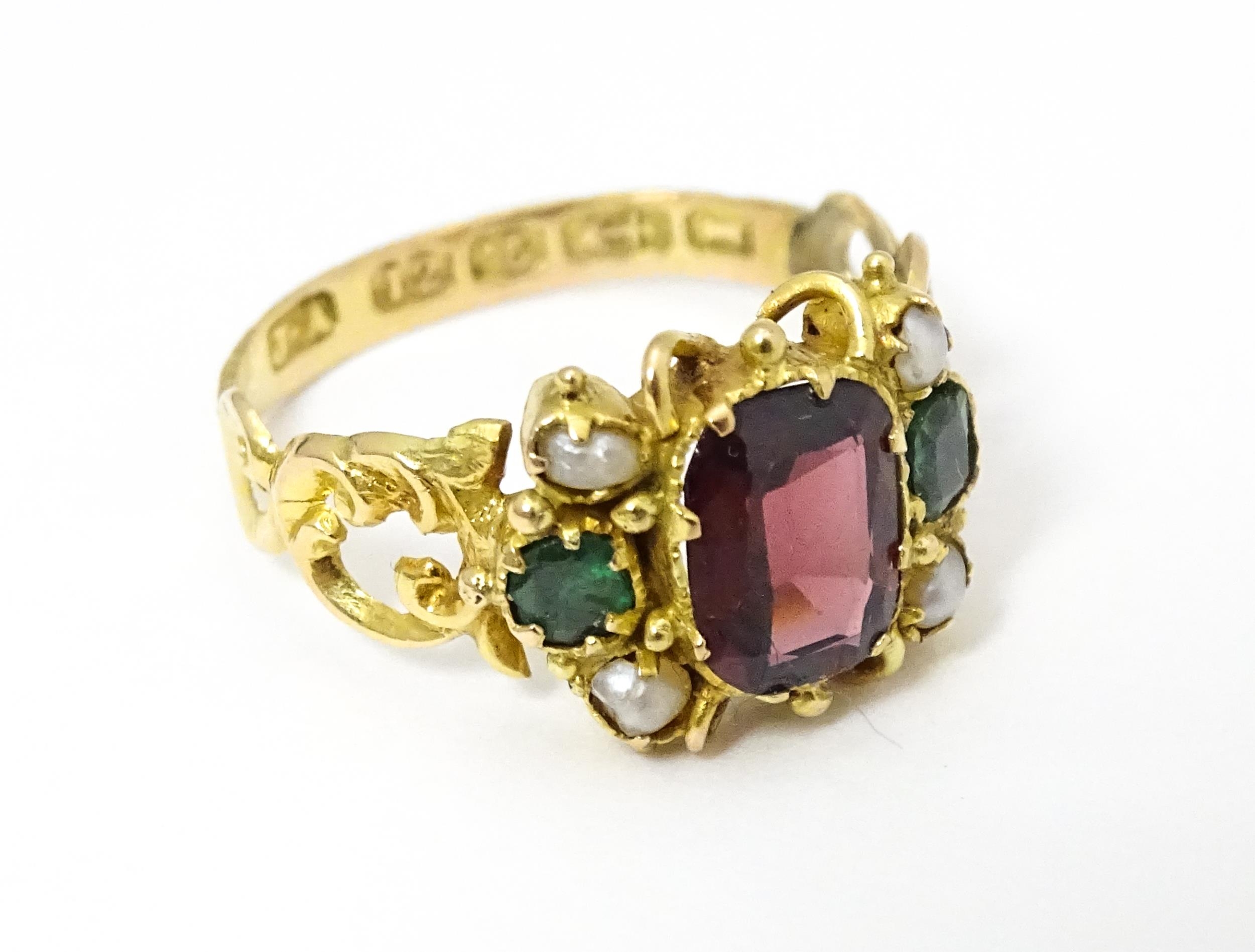 A Victorian 12ct gold ring set with garnet and pearl hallmarked Birmingham 1857. Maker J.A Ring size - Image 4 of 6