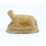 A 19thC ceramic money box modelled as a recumbent sheep. Approx. 3 1/2" high x 5 1/2" wide Please