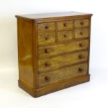 An early 19thC mahogany chest of drawers with two short drawers flanked by two deep drawers above