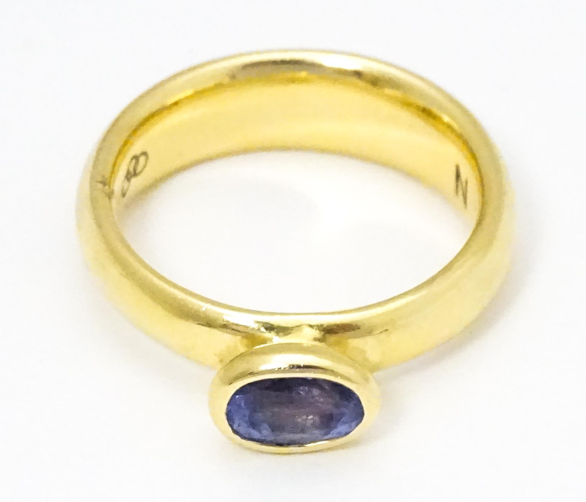 An 18ct gold ring set with oval tanzanite, maker Links of London. Ring size approx M Please Note - - Image 6 of 7