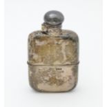 A Victorian silver hip flask. With engraved squirrel armorial. Hallmarked Sheffield 1898 maker G & J