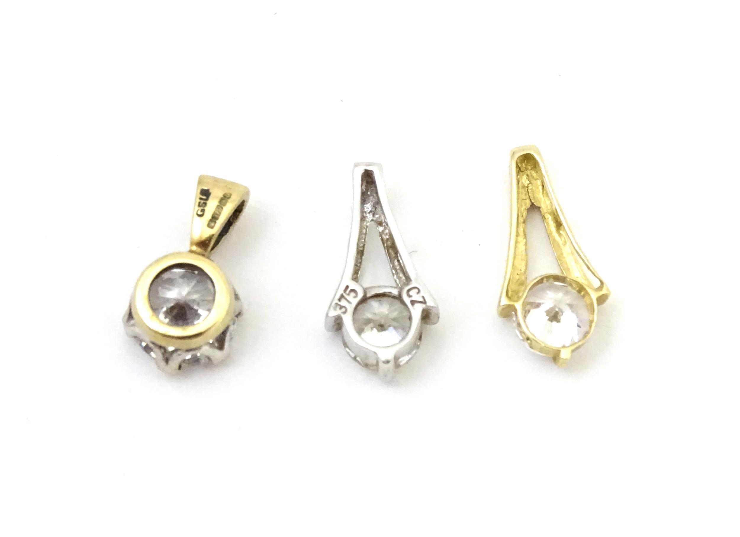 Three 9ct gold pendants set with cubic zirconia. To include a white gold example. Approx 1/2" - Image 4 of 7