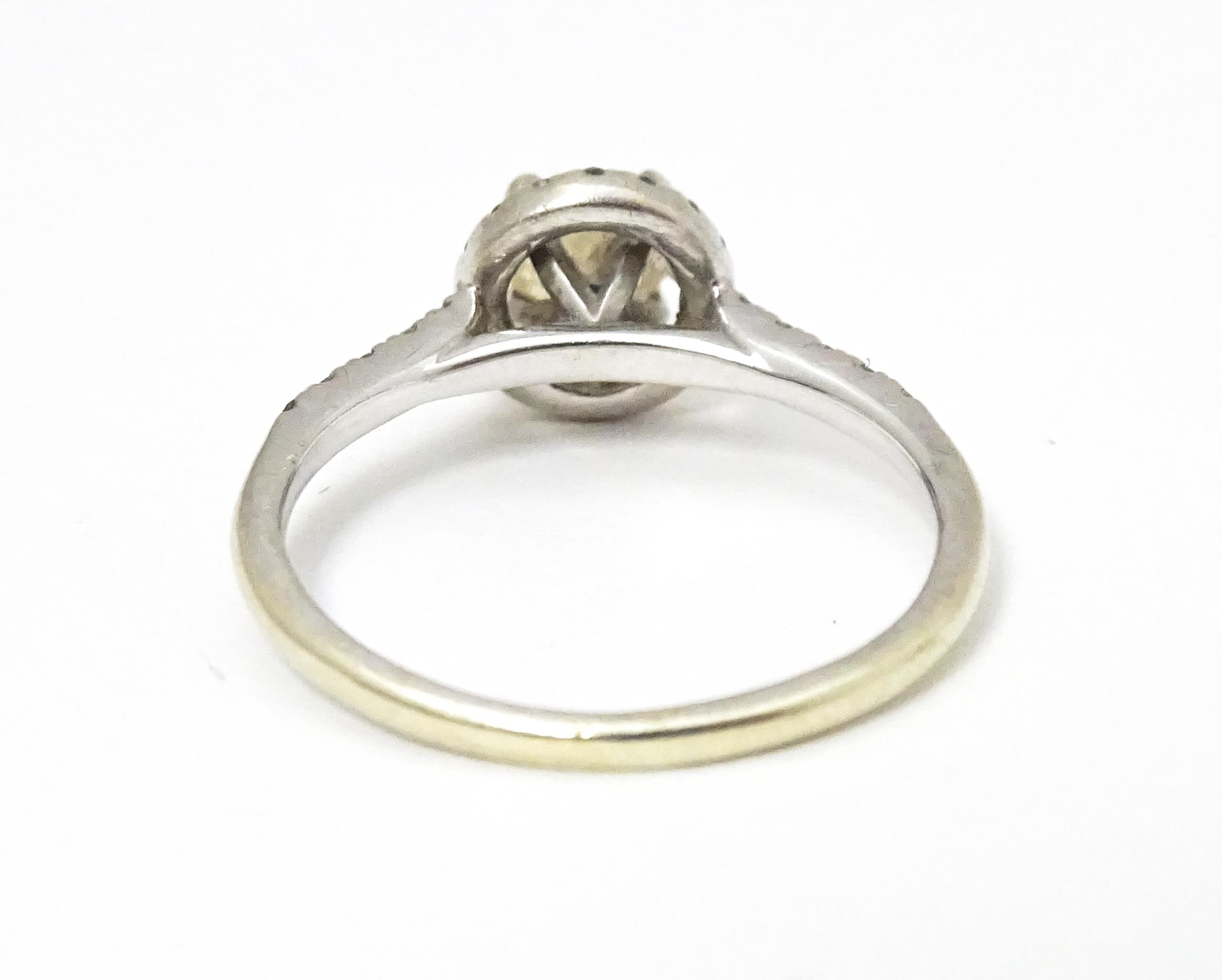 A 9ct white gold ring set with central citrine coloured stone bordered by diamonds and with - Image 5 of 5