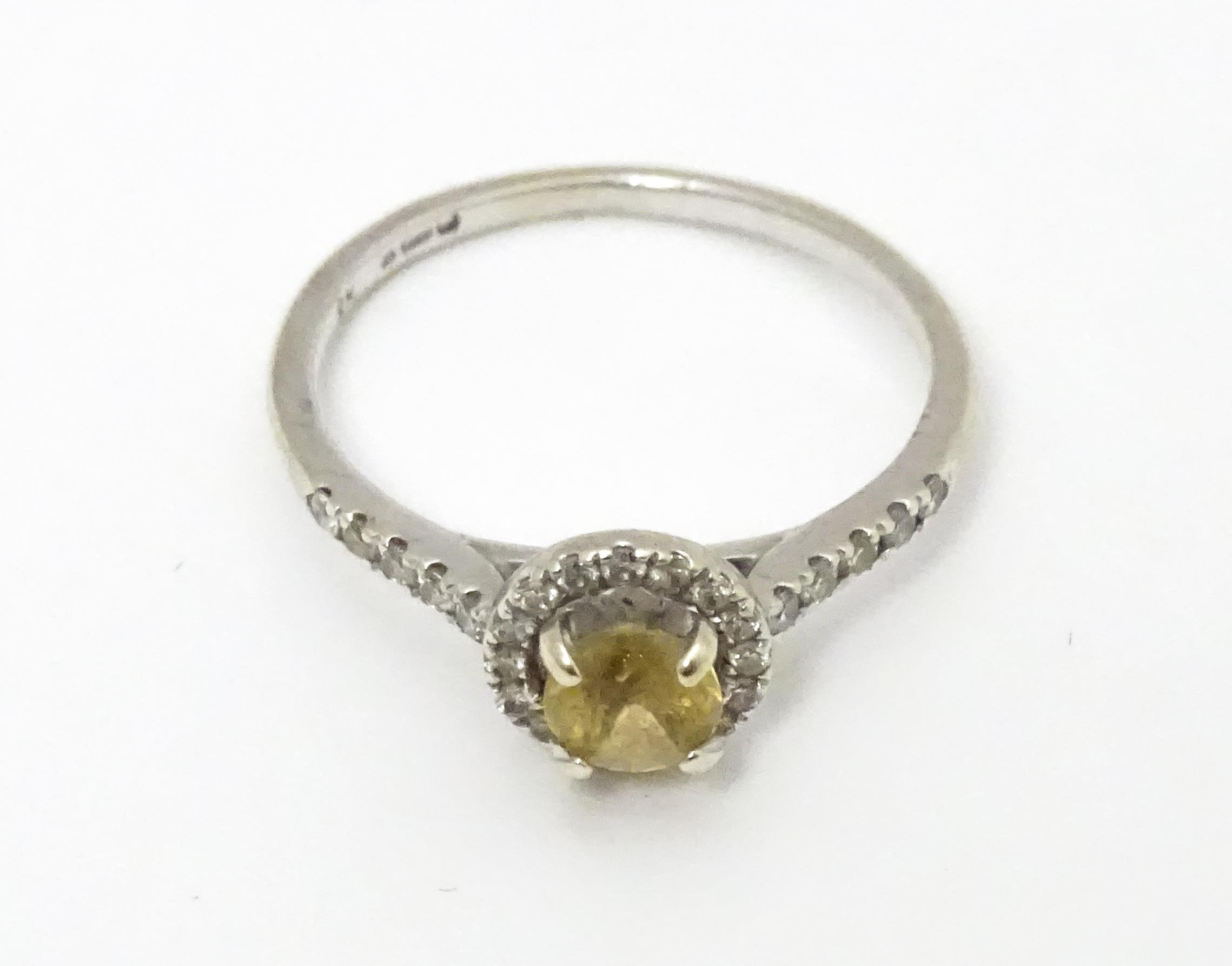 A 9ct white gold ring set with central citrine coloured stone bordered by diamonds and with - Image 4 of 5