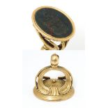 A 19thC yellow metal fob / hand seal set with Bloodstone with engraved armorial. Approx 1 1/2" high,