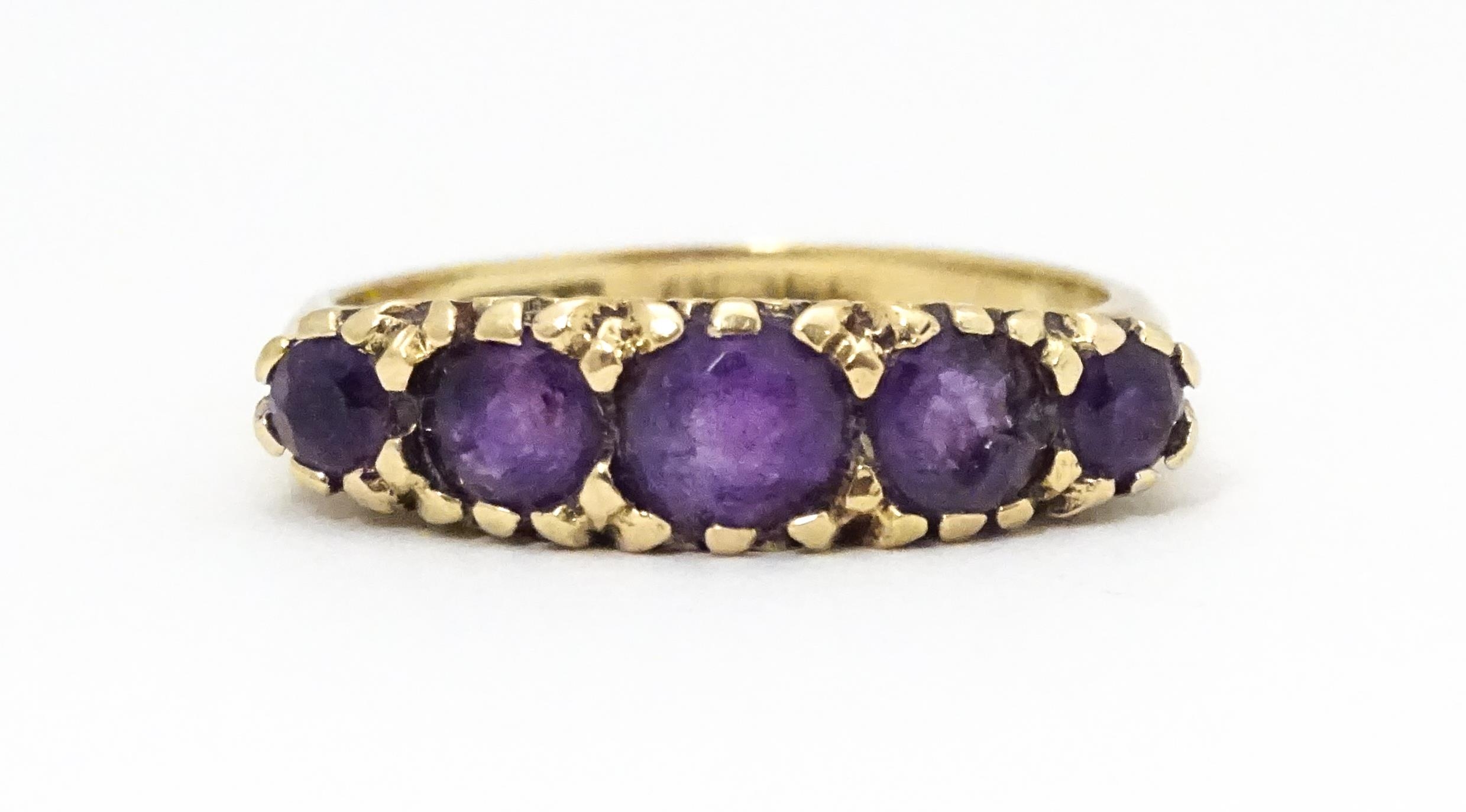 A 9ct gold ring set with 5 graduated amethysts. Ring size approx L 1/2 Please Note - we do not - Image 4 of 6