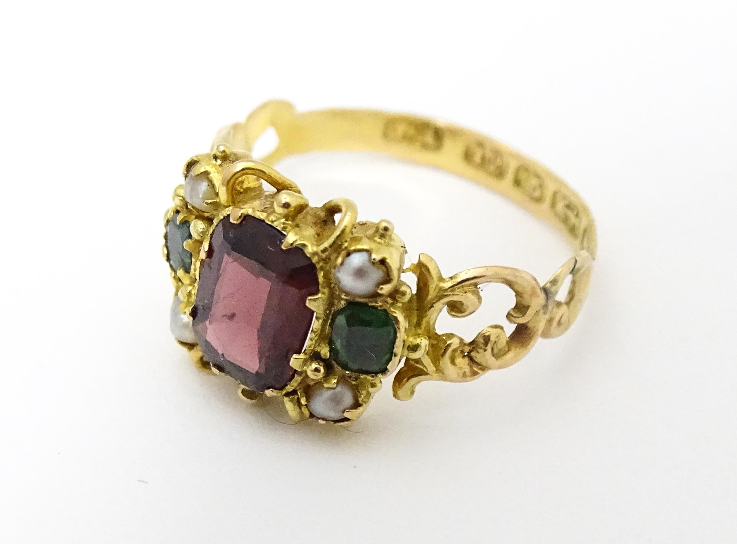 A Victorian 12ct gold ring set with garnet and pearl hallmarked Birmingham 1857. Maker J.A Ring size - Image 3 of 6