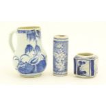 A Chinese blue and white jug decorated with trees, leaves, flowers and foliage. Together with a